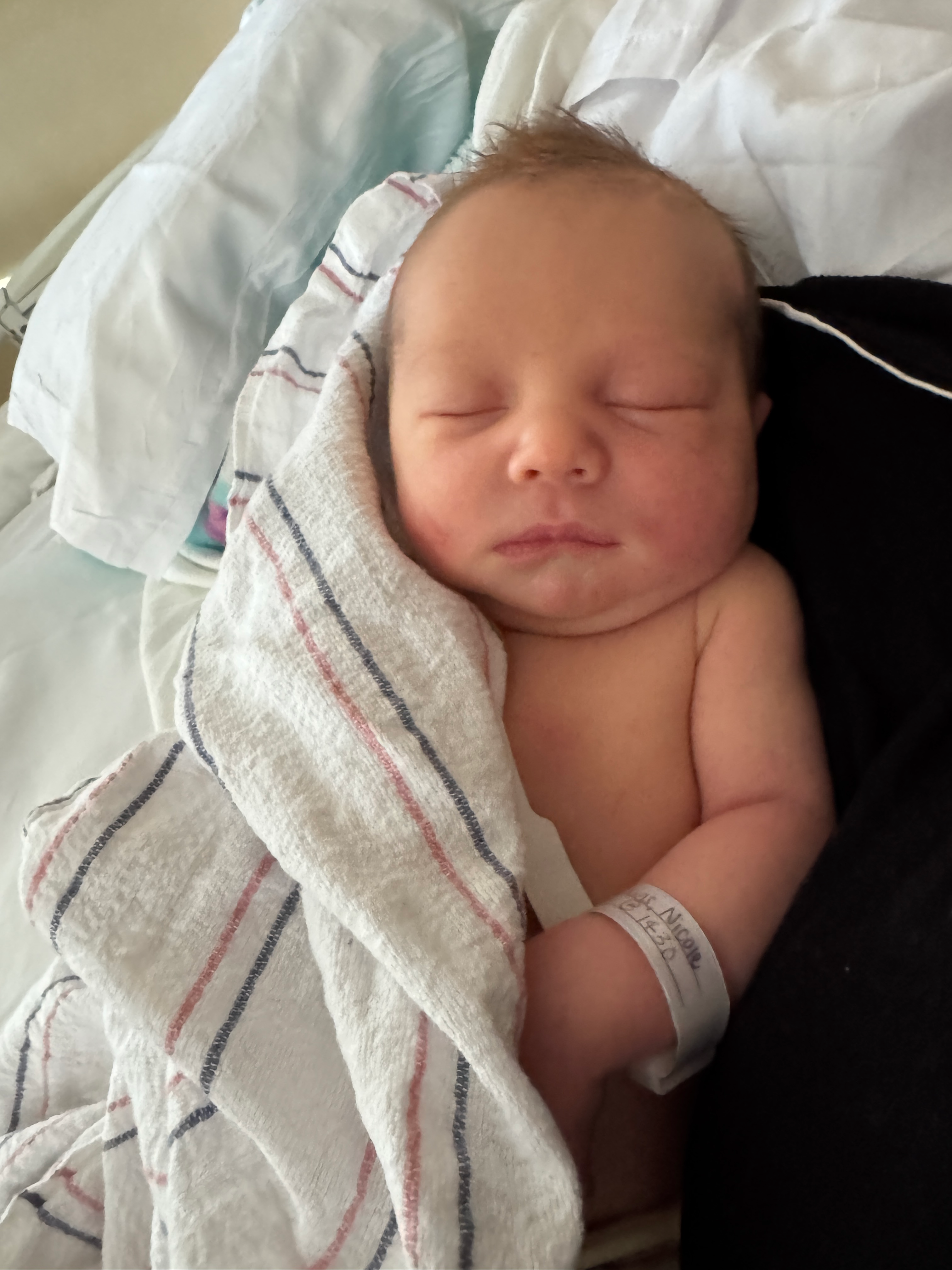Nate sleeping while swaddled shortly after birth
